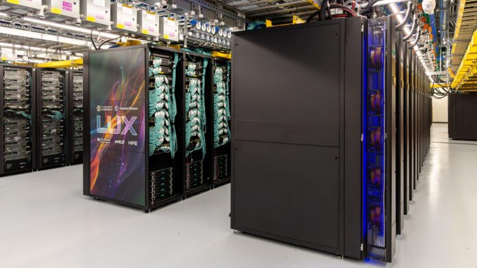 Views of the LUX computer system at Oak Ridge National Laboratory show server racks, networking cables, cooling infrastructure, safety signage, and installation work inside the high-performance computing data center on July 17, 2026.
